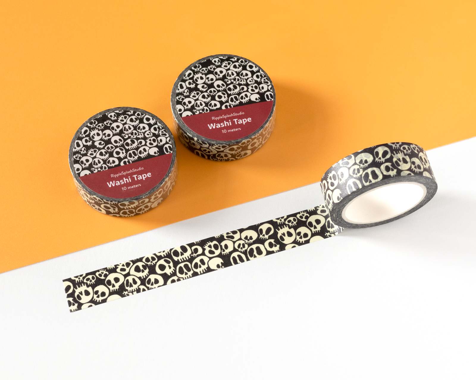 Washi tape with skull pattern on a white and orange background